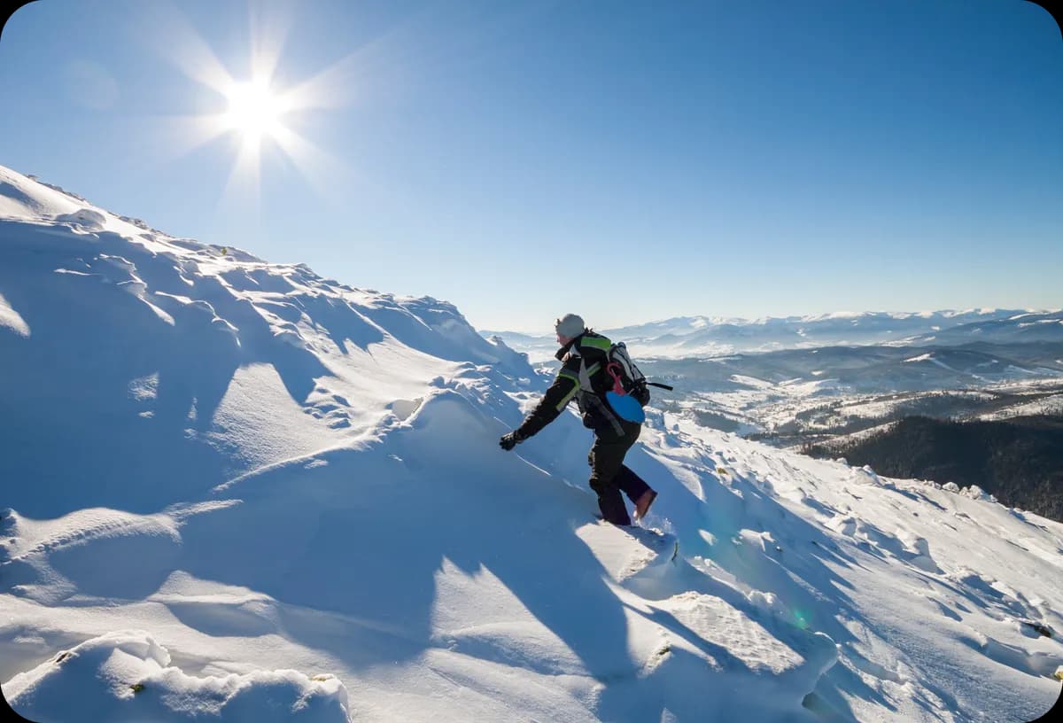 A man climbs a mountain