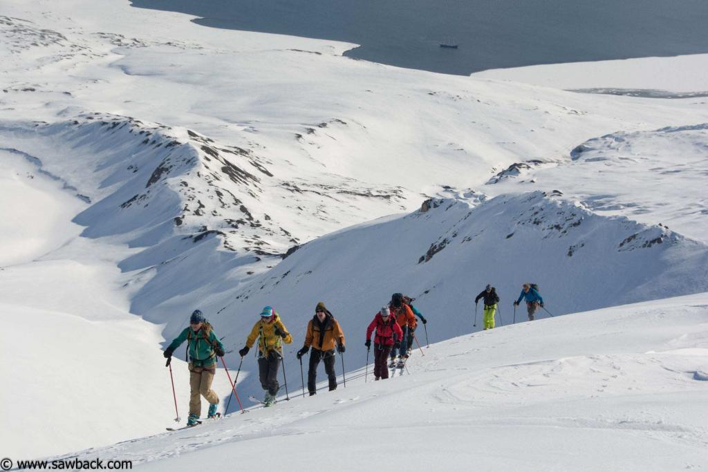 Ascending the perfect ski peaks overlooking Ymerbukta